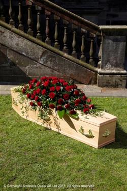 Red rose coffin tribute