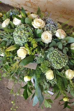 Seasonal blue, white and lime coffin tribute